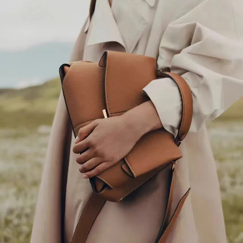 French niche hand-held diagonal cross women's bag new trend Mokki series fashionable pleated smile bag