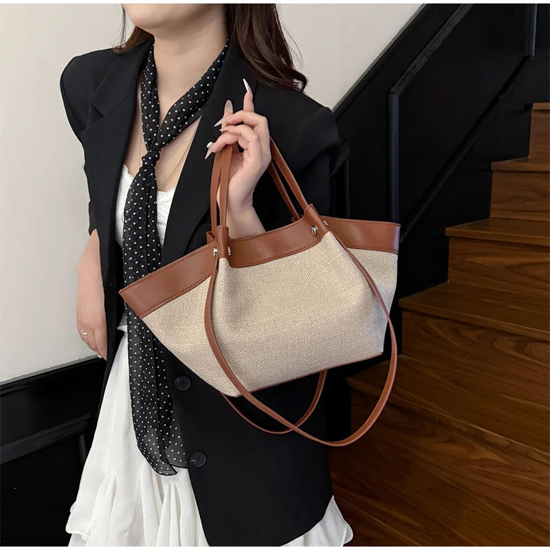 Canvas Leather Brand Wing Shoulder Bag Niche Luxury Fashion New Versatile Commuter Large Capacity High-end Tassel Underarm Bag