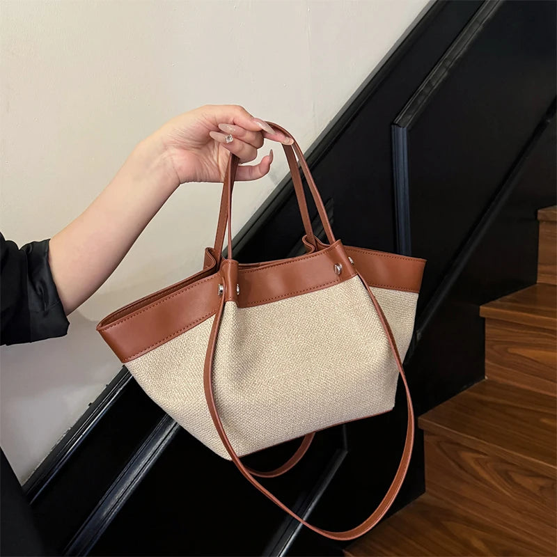 Canvas Leather Brand Wing Shoulder Bag Niche Luxury Fashion New Versatile Commuter Large Capacity High-end Tassel Underarm Bag