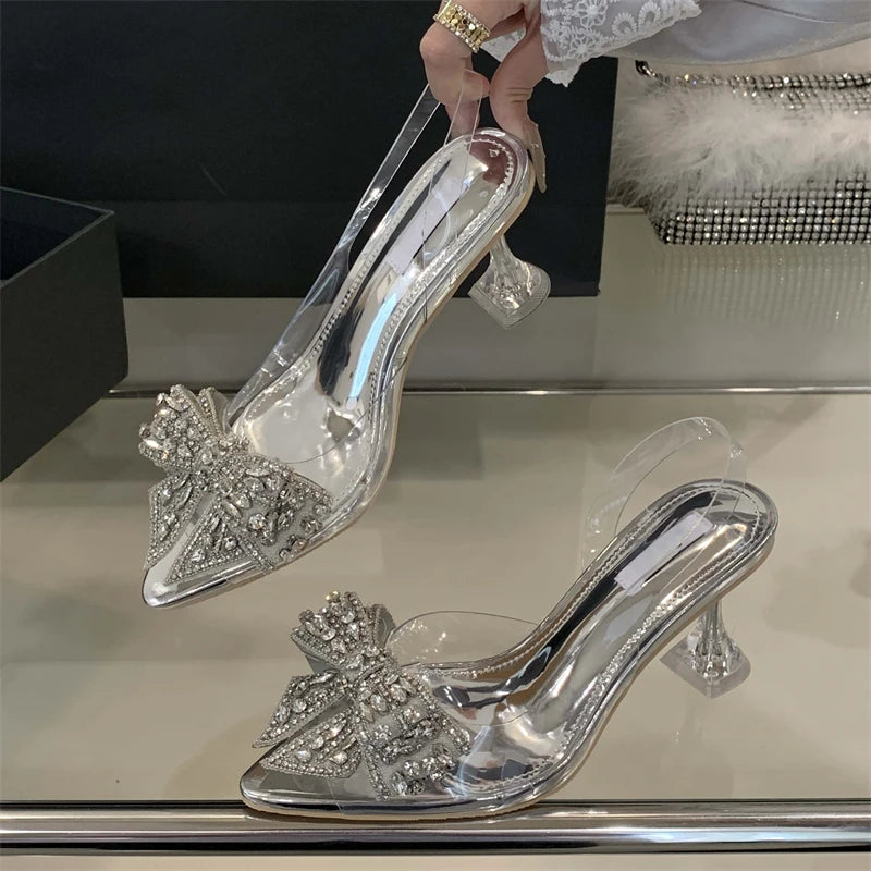 Aneikeh Sexy Pointed Toe Bow Crystal PVC Transparent Women Slingbacks Pumps Elegant Thin High Heels Strippers Prom Mule Shoes